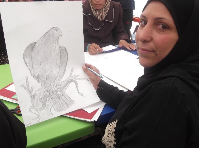 ... practices her hobby of drawing at a facility run by <b>Noor Al</b> Hussein - institute-for-family-health-photo